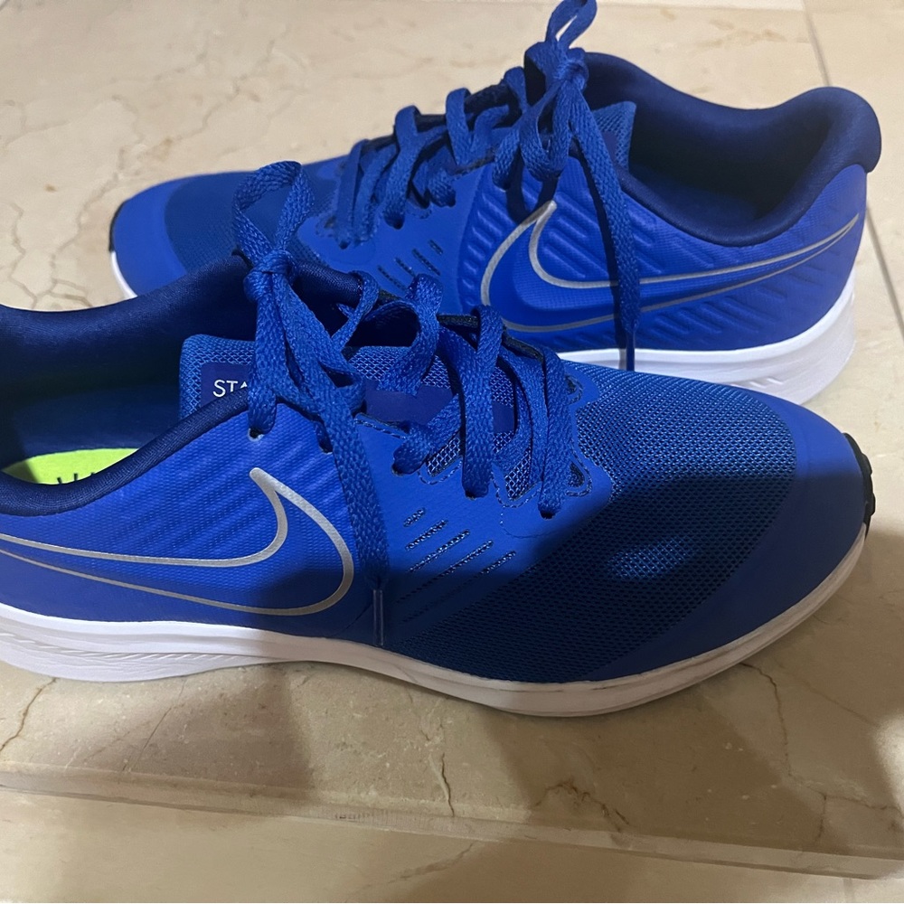 Royal Blue, Star-Runner Nike shoes, slightly used. Youth 5.5/ Women’s size 7